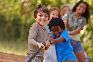 Children Being Active playing tug of war