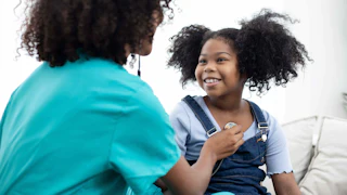 Intensive Health Behavior and Lifestyle Treatment & Motivational Interviewing Doctor with Young Patient