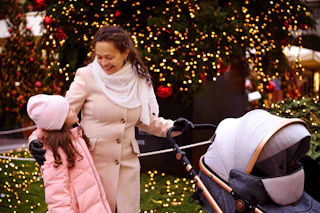 Family walking looking at xmas lights