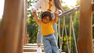 Mom and toddler on swinging bridge