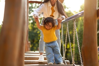 Mom and toddler on swinging bridge