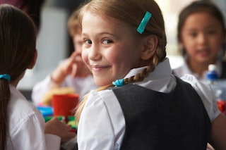Young Child Eating School Lunch